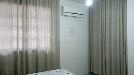 Quarto com ar condicionado