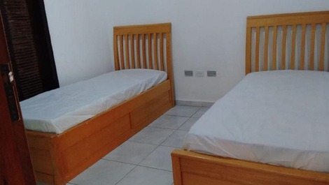 Casa Moyra Bertioga - Pe na areia com vista para o mar