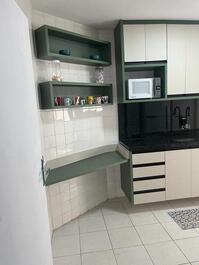 Cozinha com espaço cafe 