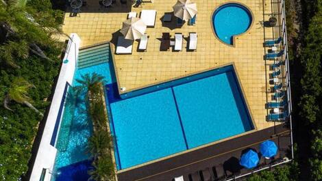 Apartment straight out of a soap opera, resort-style, right on the sand, swimming pools.