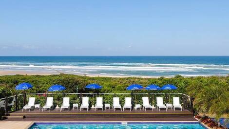 Apartment straight out of a soap opera, resort-style, right on the sand, swimming pools.