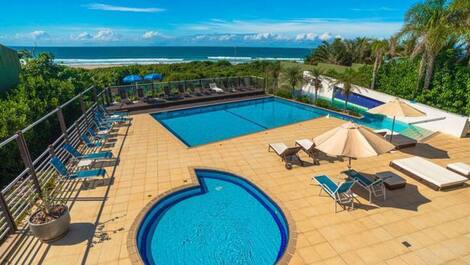Apartment straight out of a soap opera, resort-style, right on the sand, swimming pools.