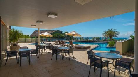 Apartment straight out of a soap opera, resort-style, right on the sand, swimming pools.