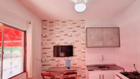 Cozinha e sala integradas compõem o ambiente da entrada.