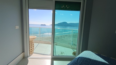 Oceanfront property with jacuzzi and charcoal grill, including 2 private parking spaces.