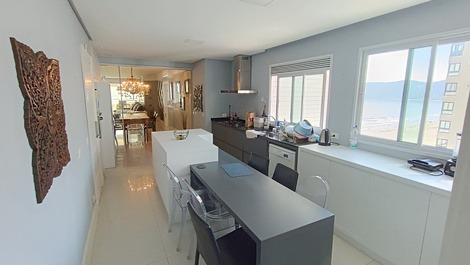 Oceanfront property with jacuzzi and charcoal grill, including 2 private parking spaces.