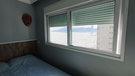 Oceanfront property with jacuzzi and charcoal grill, including 2 private parking spaces.