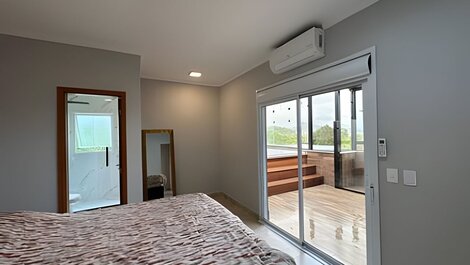 Spacious duplex with ocean view and hot tub.