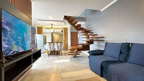 Spacious duplex with ocean view and hot tub.