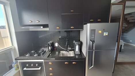 Spacious duplex with ocean view and hot tub.