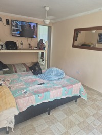 Quarto da suíte superior da casa verde