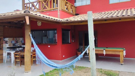 Churrasco, sinuca e um cochilo na rede.