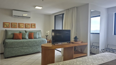 Sala integrada com cama de solteito 
