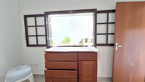 House with pool and barbecue area in a gated community.