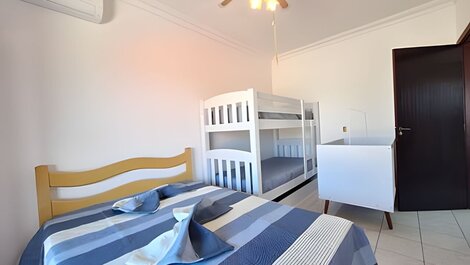 House with balcony and barbecue in gated community.