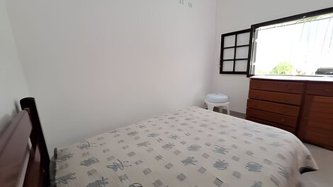 House with pool and barbecue area in a gated community.