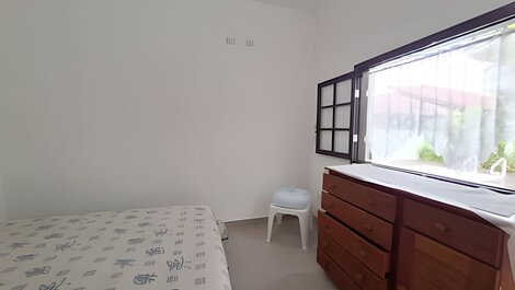 House with pool and barbecue area in a gated community.