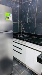 Studio apartment, cozy, bedroom, kitchen, bathroom.