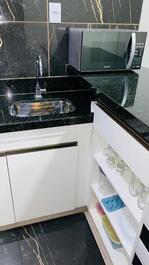 Studio apartment, cozy, bedroom, kitchen, bathroom.