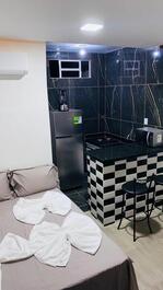 Studio apartment, cozy, bedroom, kitchen, bathroom.