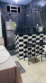 Studio apartment, cozy, bedroom, kitchen, bathroom.