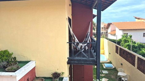 Uma rede na varanda para ver o sol nascer no mar...