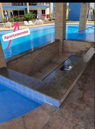 Vista da área de lazer, mostrando a localização do apartamento 