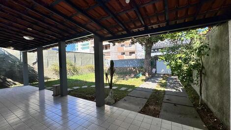 House with barbecue and backyard.