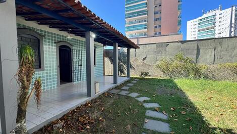 House with barbecue and backyard.