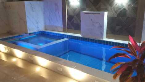 Piscina com aquecimento (opcional), led, cascata, hidromassagem, caminhos de luz